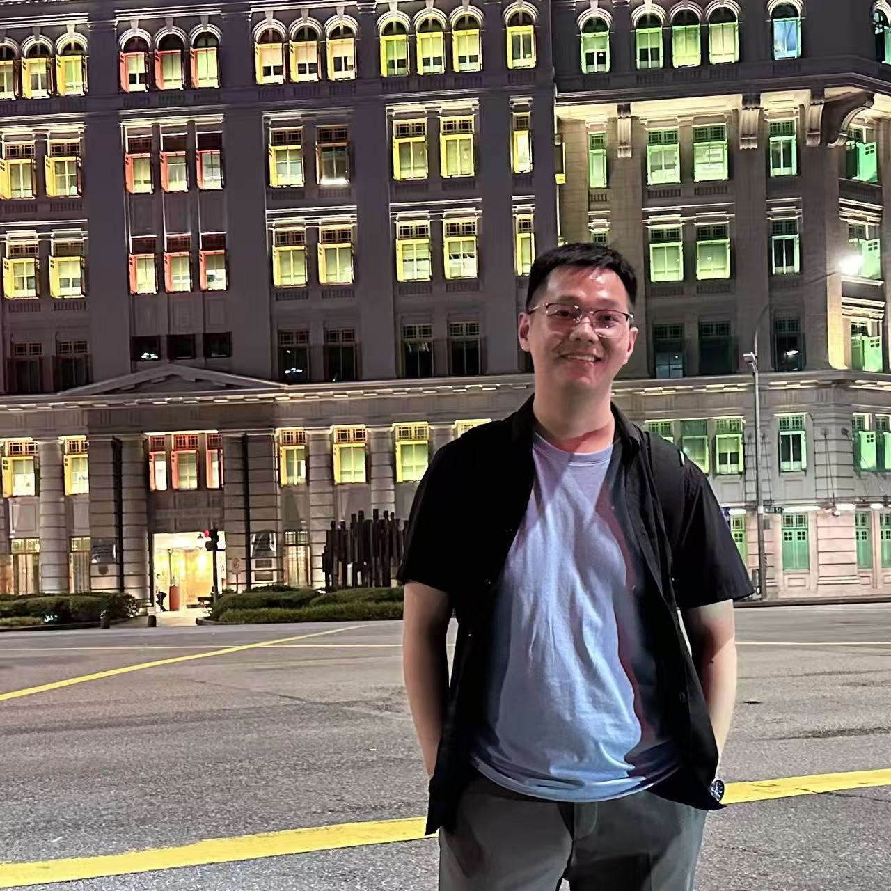 Shihao Ru standing outdoors at night.
